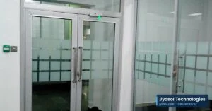 Glass double doors with access control and an exit button in an office