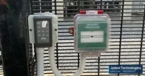Keypad reader and emergency door release on a mesh security gate