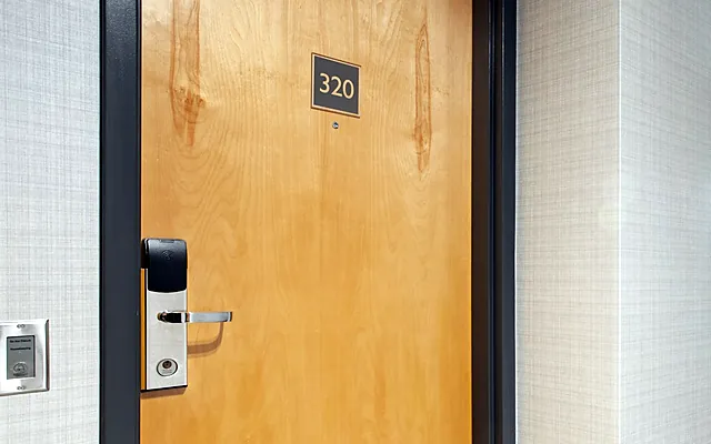 Hotel room door fitted with an RFID card lock
